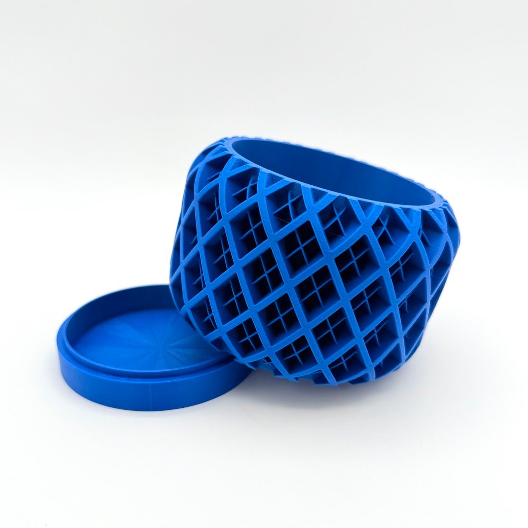 blue geoplaid 3d printed planter tilted on tray